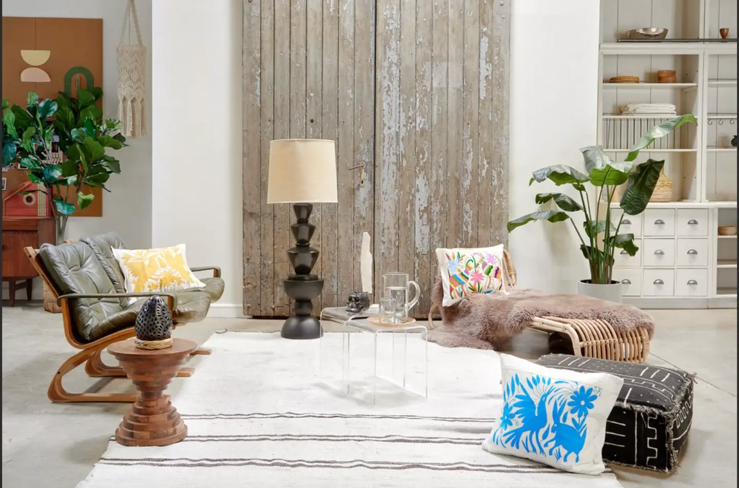 Layered living room furnished with artisan textiles and sculptural objects